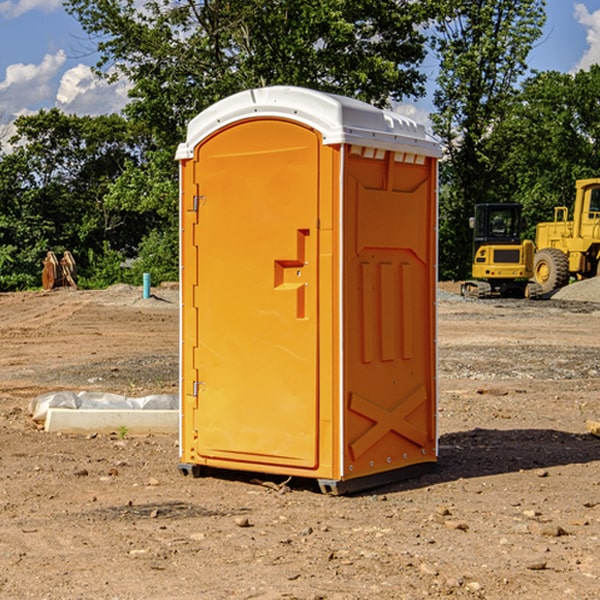 what is the cost difference between standard and deluxe portable toilet rentals in Russellville